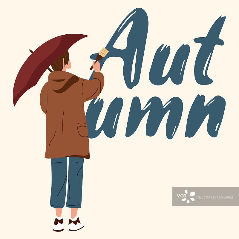 用刷子在墙上写秋天文字的人图片素材