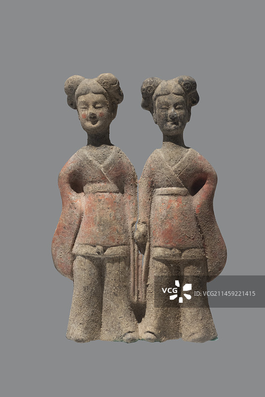 北魏彩绘陶牵手女俑图片素材