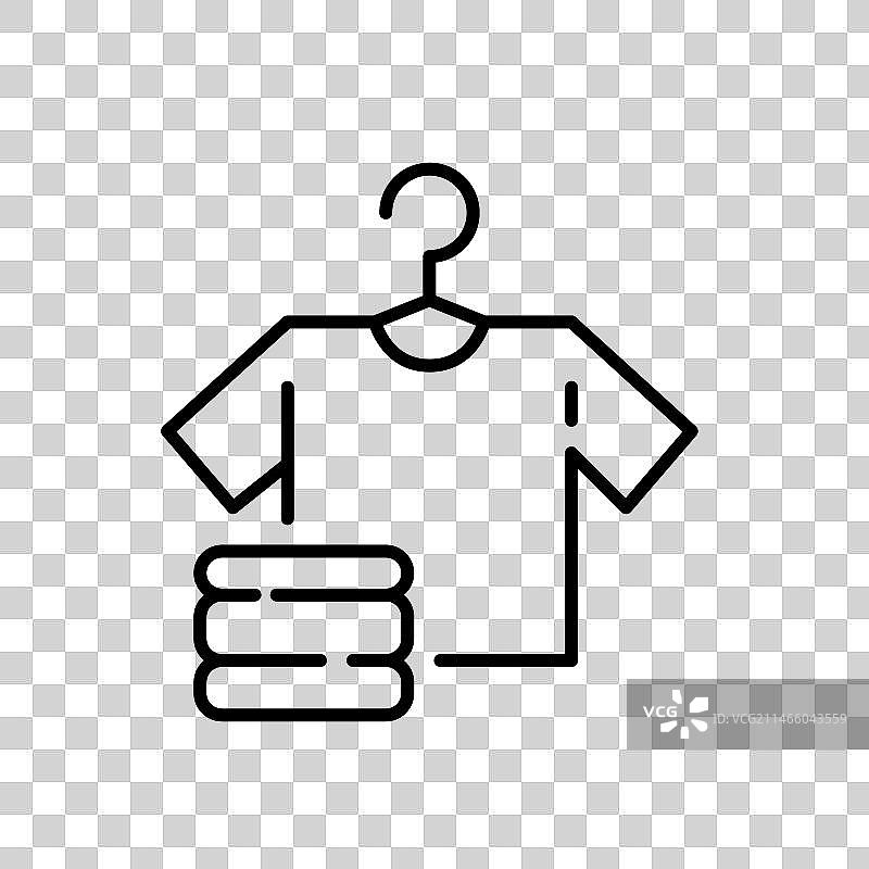 衣架上的白色T恤和叠好的衣服图片素材