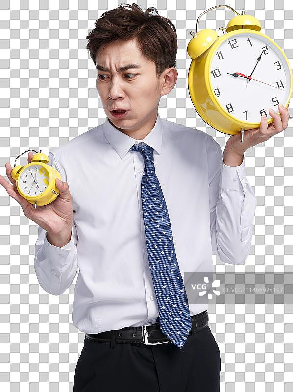 商务青年男人拿着闹钟图片素材