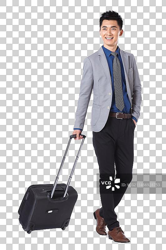 商务男士拉着行李箱图片素材