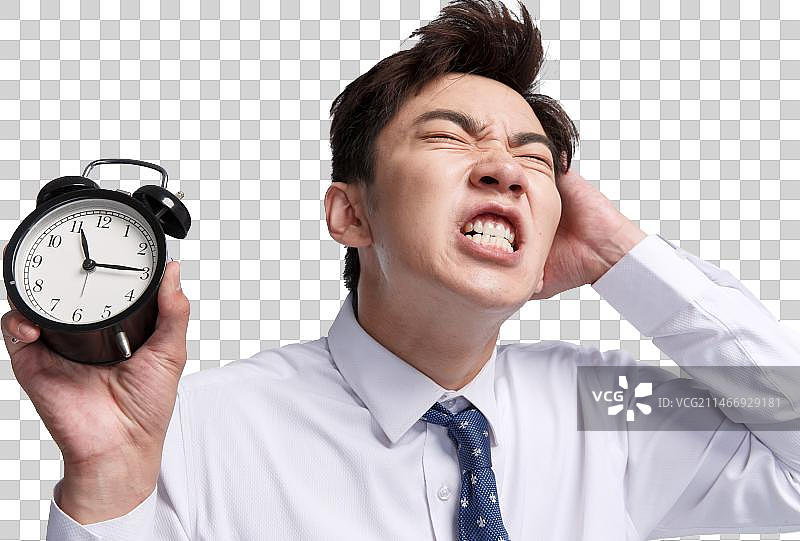 表情痛苦的商务青年男人拿着闹钟图片素材