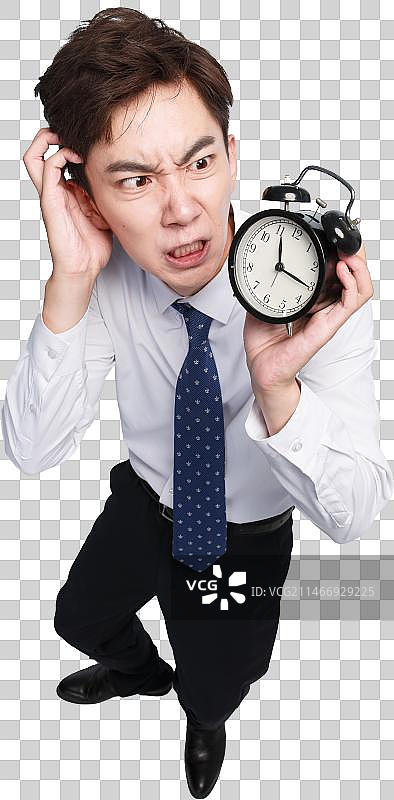 商务青年男人拿着闹钟图片素材