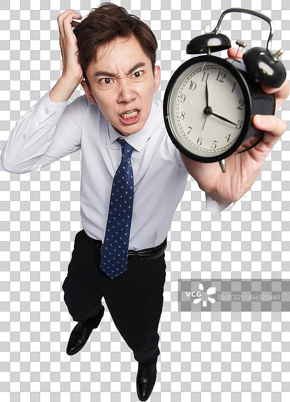 商务青年男人拿着闹钟图片素材