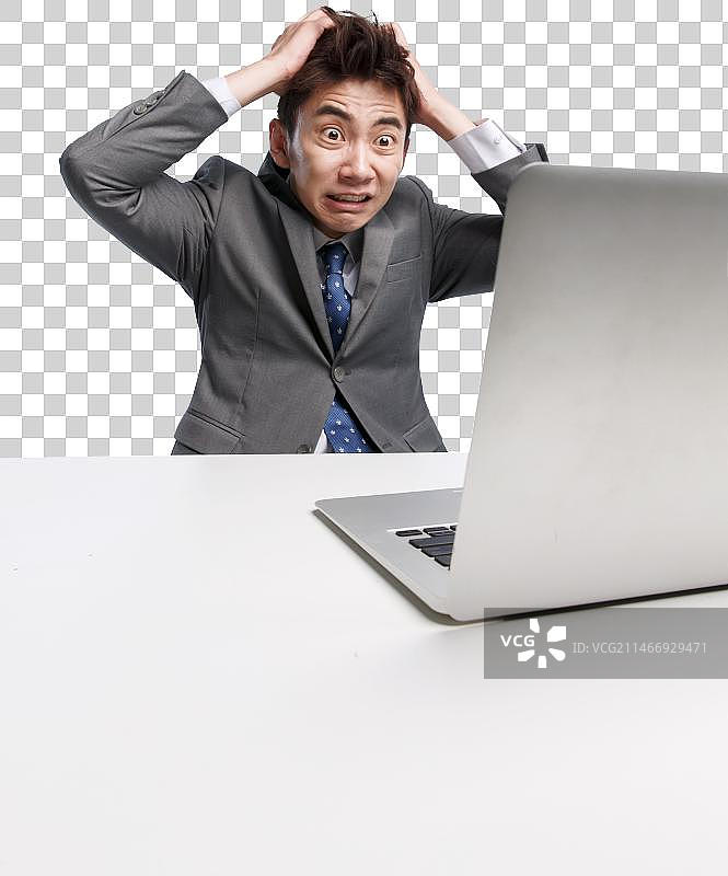 面部表情痛苦的商务青年男人图片素材