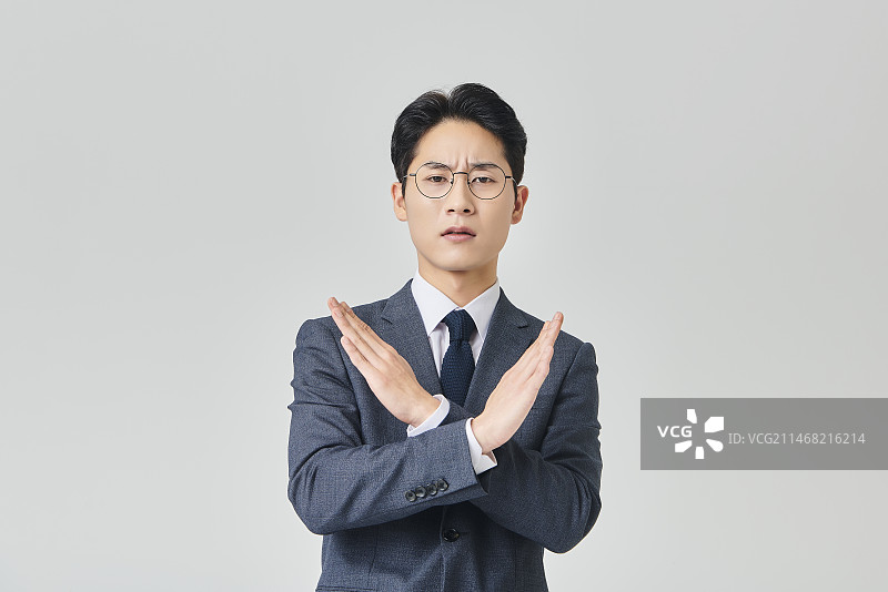 做叉手势的商人图片素材