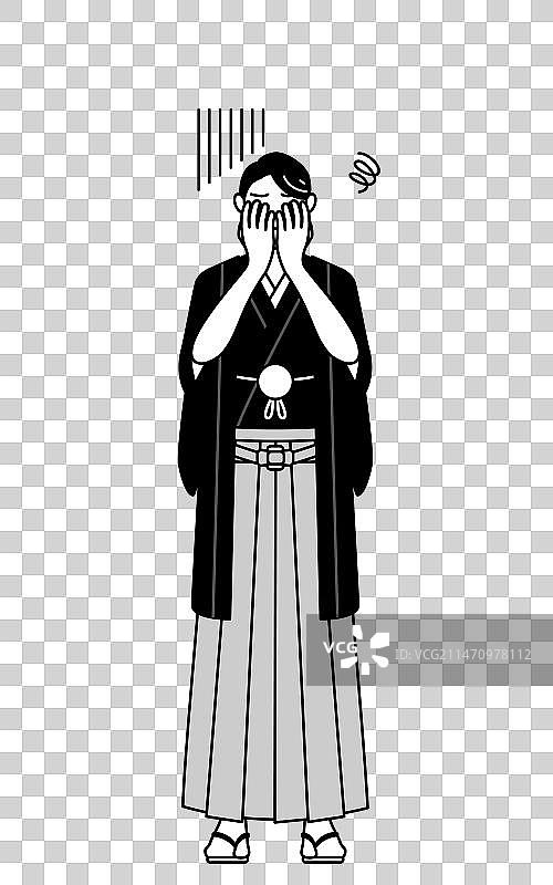 戴着带家徽的袴的男人遮住了脸图片素材