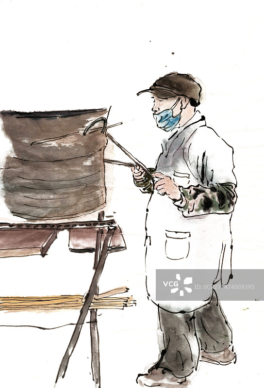 烤烧饼的男子图片素材