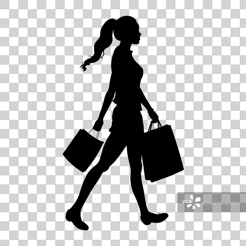 手提购物袋的女子剪影图片素材