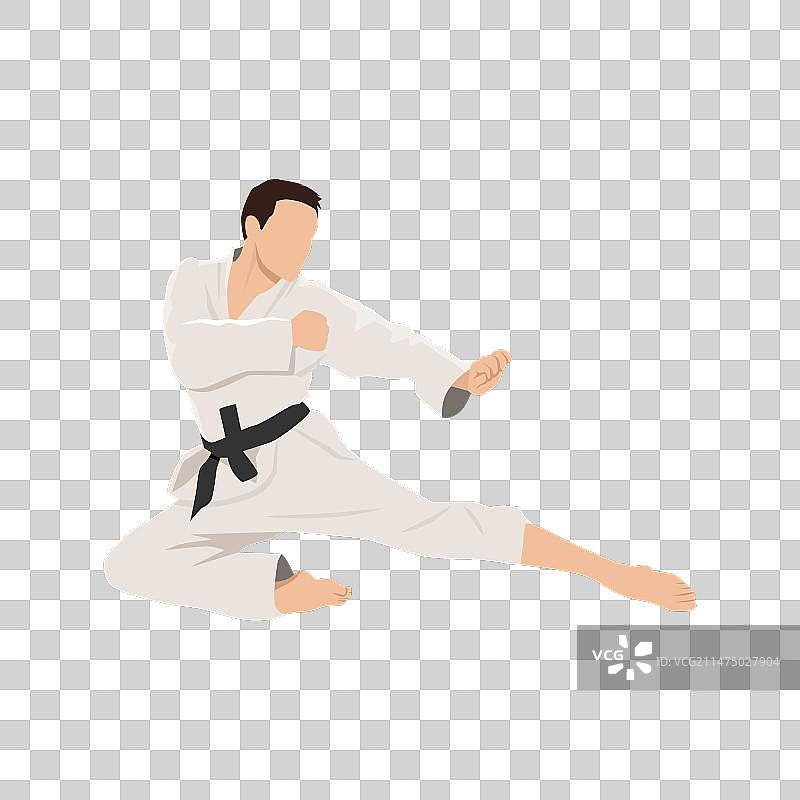 年轻的空手道男子飞踢图片素材