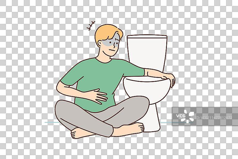 男人在马桶旁感到恶心想吐图片素材