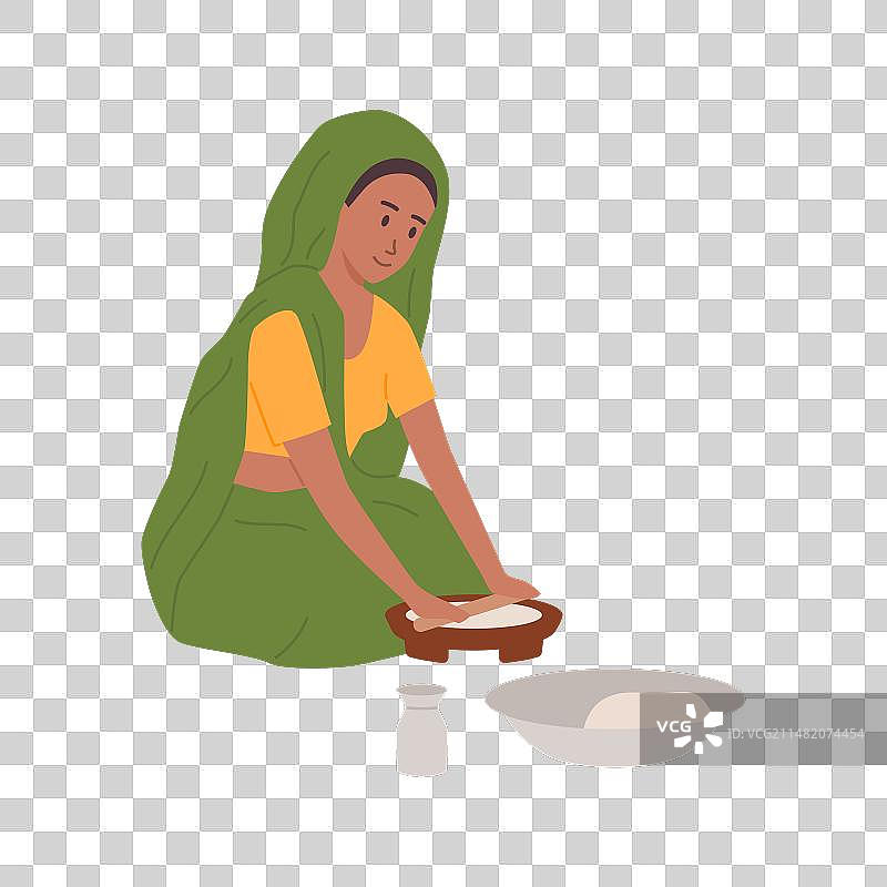 印度农村妇女用传统方式烹饪食物图片素材