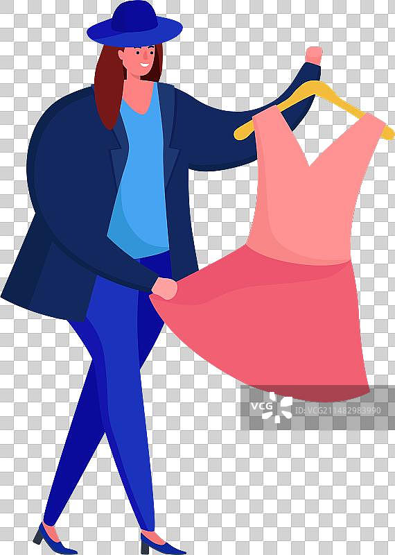 手持粉色连衣裙挂在衣架上的时尚女人图片素材