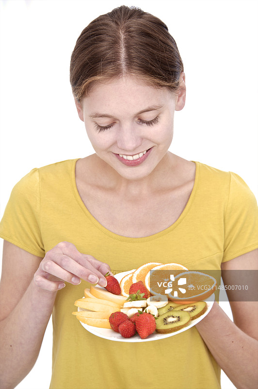 手持水果的女人图片素材