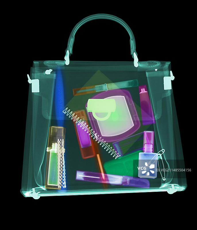 彩色X光下的女士手提包及其物品图片素材