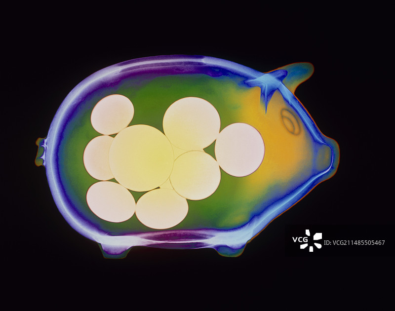 装有硬币的存钱罐的彩色X光片图片素材