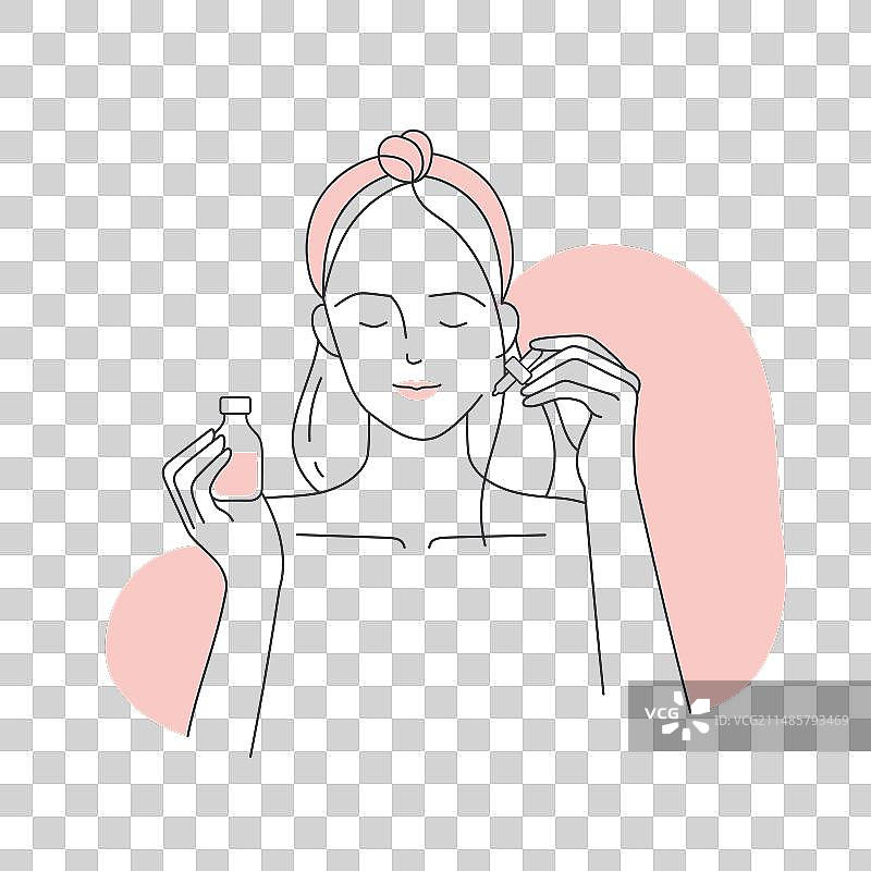 女人使用面部精华液图片素材