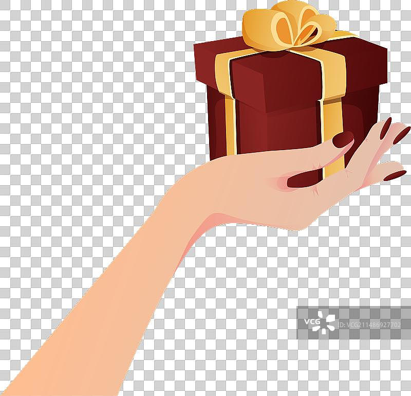 手拿系着金色蝴蝶结的红色礼品盒图片素材