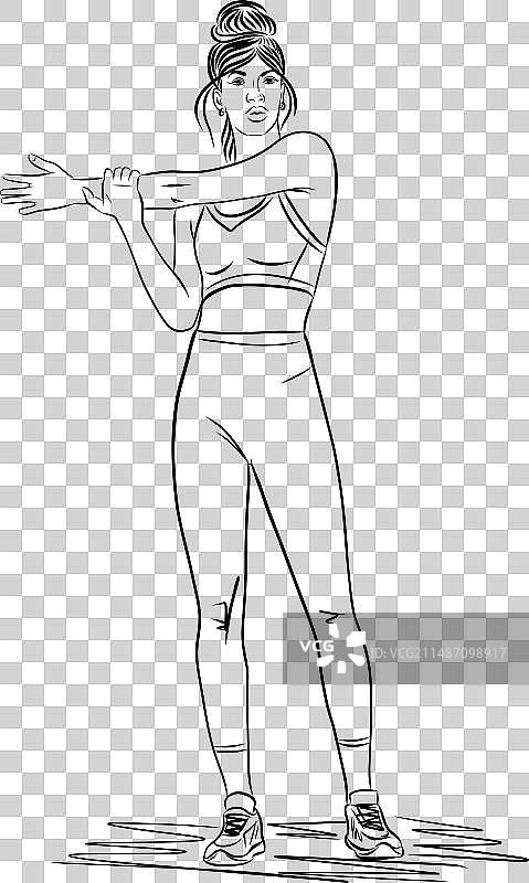 在健身房做拉伸运动的年轻女子图片素材