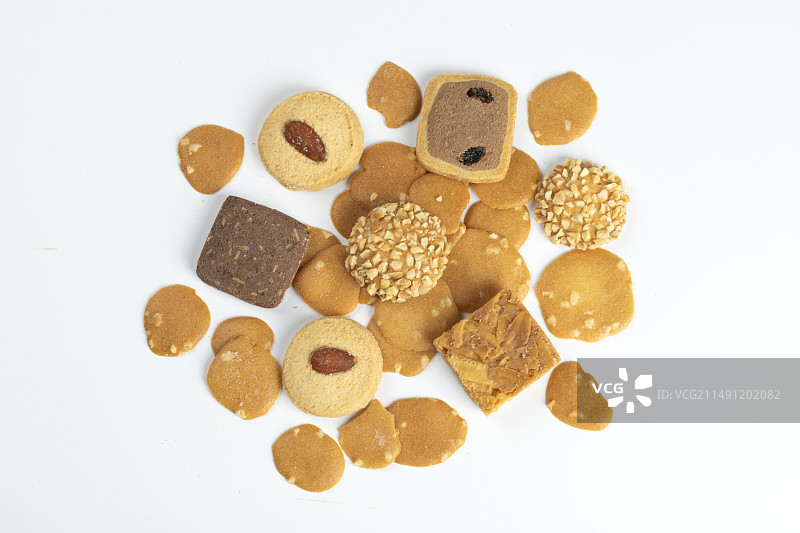 大量堆积的美味的不同口味的曲奇饼干点心零食图片素材