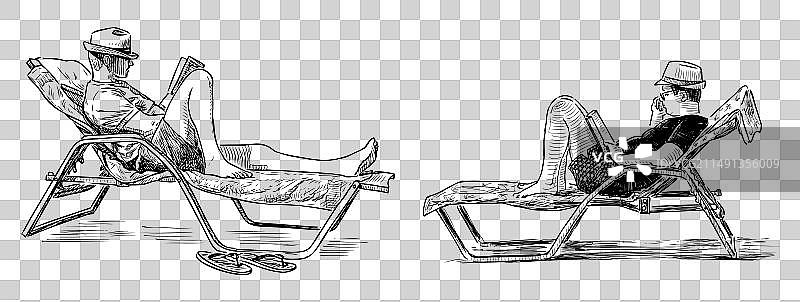 戴帽子的男人躺在沙滩度假的躺椅上图片素材