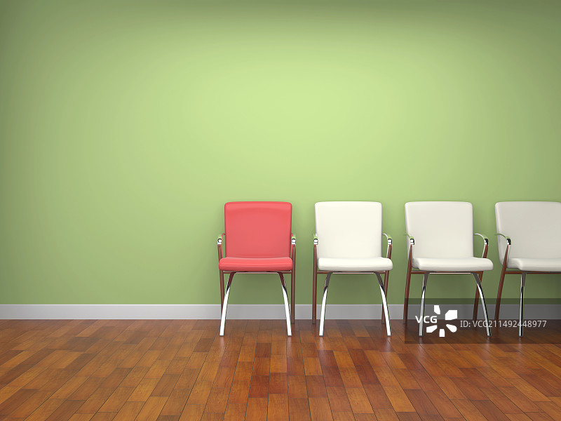 绿色墙壁前的一排椅子图片素材