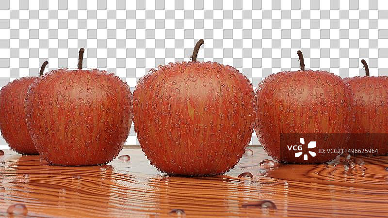 桌面摆放着沾满雨露的苹果特写图片素材