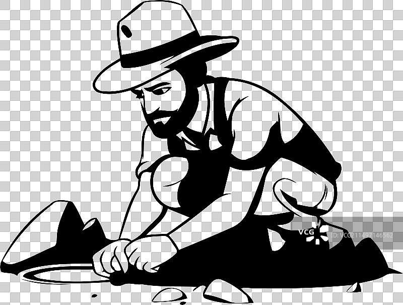 男人用铲子在地上挖洞图片素材