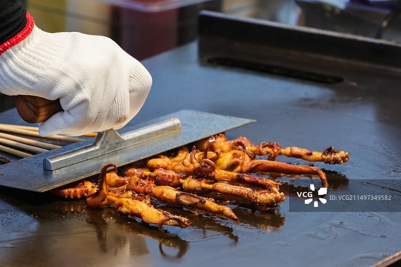 街头美味烧烤烤鱿鱼图片素材