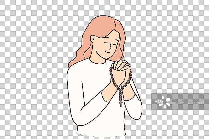 手持念珠祈祷的宗教妇女图片素材