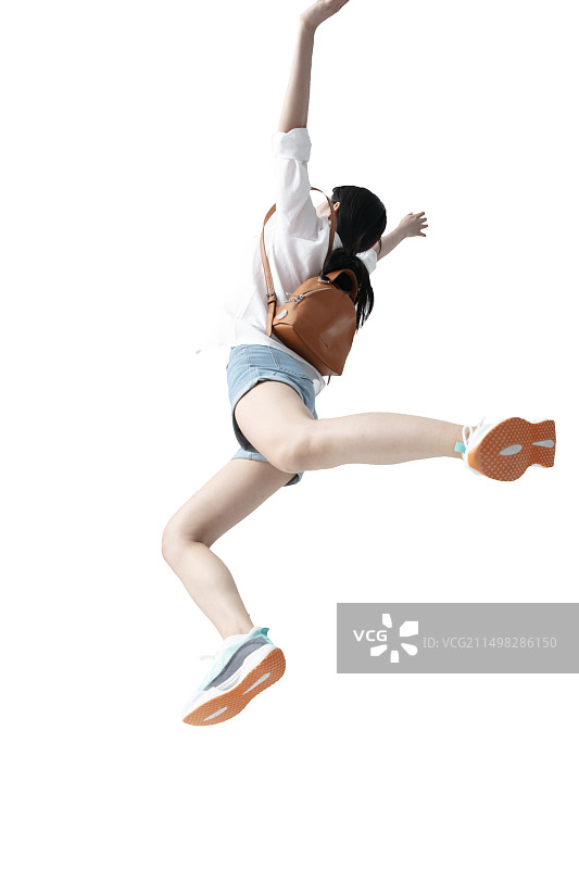 背着小背包奔跑的年轻女学生图片素材