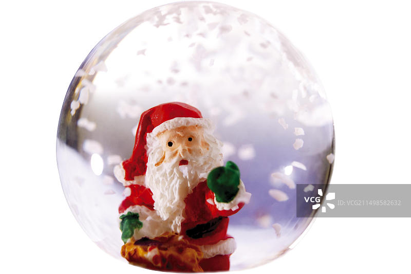 带有圣诞老人形象的雪景球图片素材