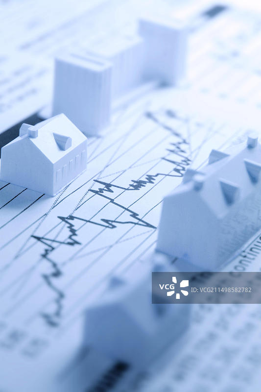 金融报纸上的迷你建筑图片素材