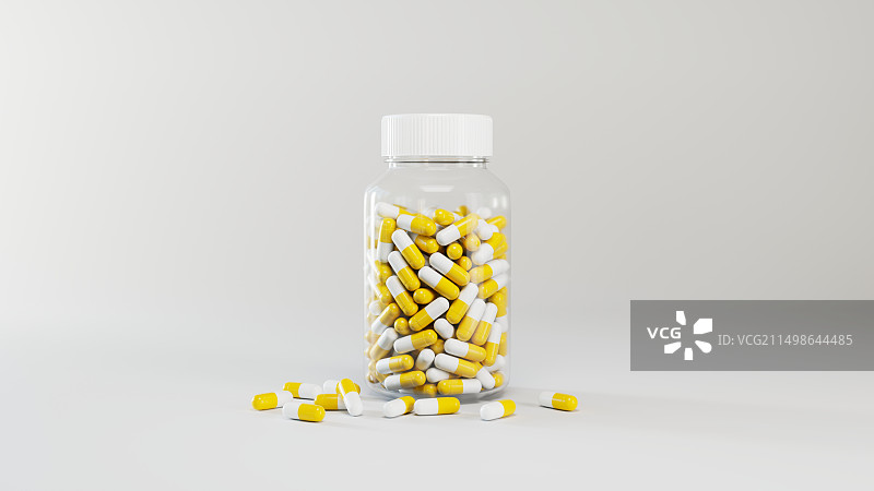 一个透明药瓶中的黄色胶囊药物图片素材
