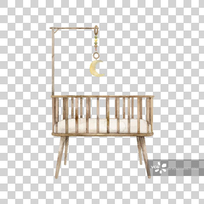 带手机的新生儿木制婴儿床图片素材