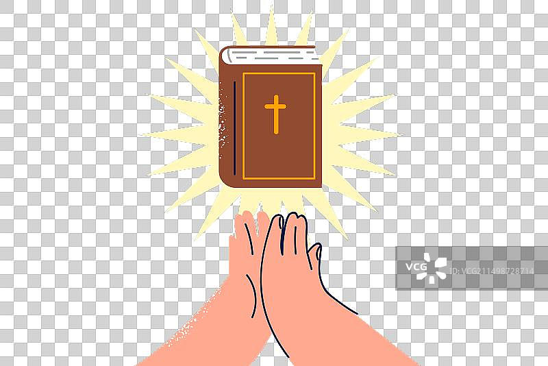 祈祷者手边的圣经与光芒图片素材