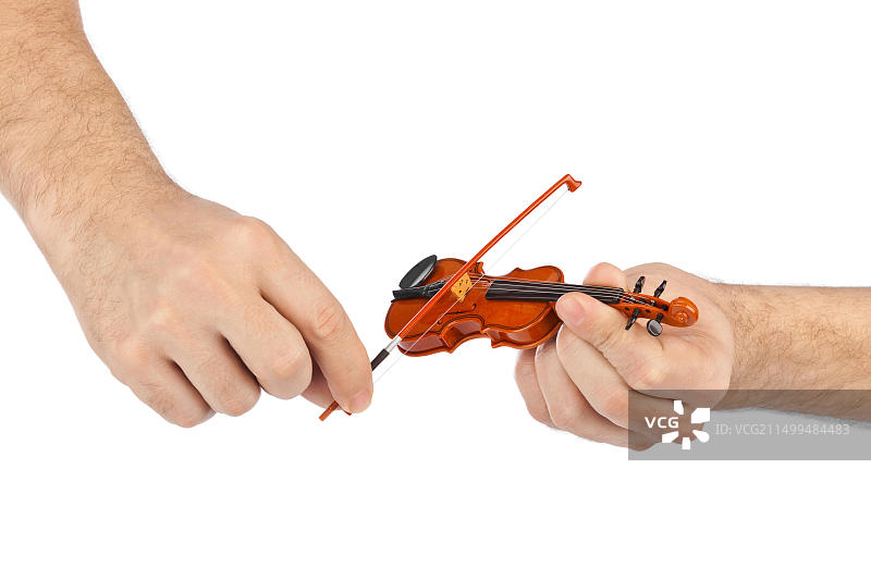 手与玩具小提琴图片素材