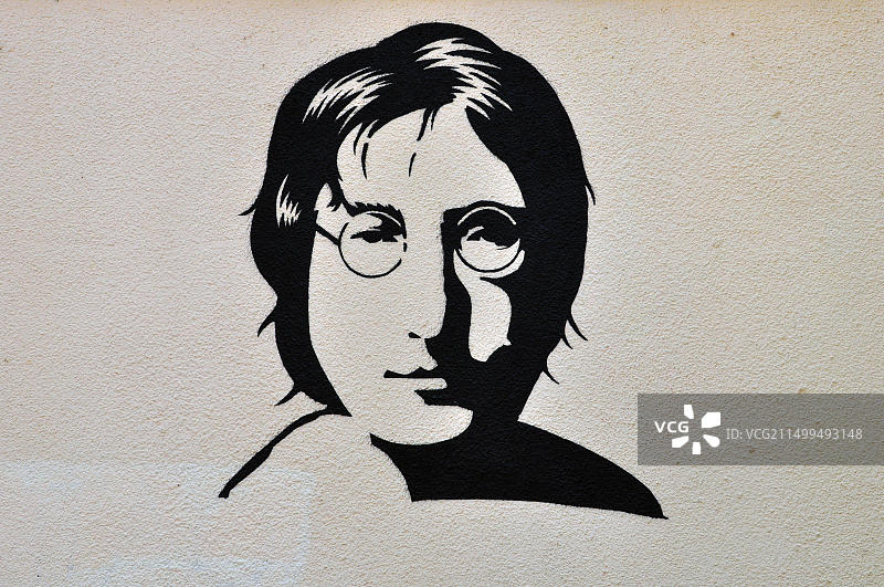 纹理墙上的约翰·列侬肖像涂鸦图片素材