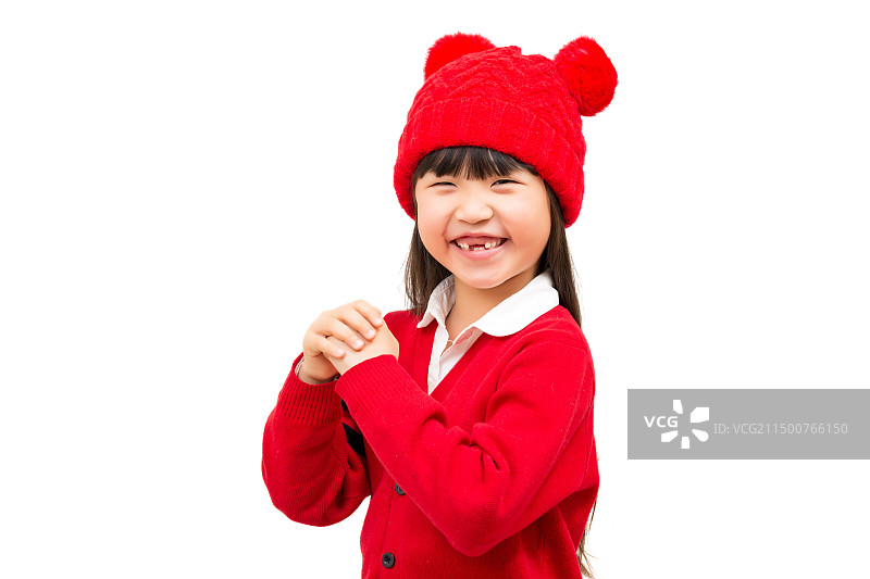 白色背景前双手抱拳开心的小女孩图片素材