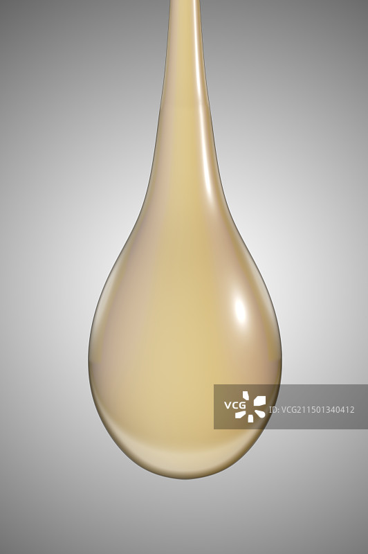 油滴精华液润滑油滴落在灰色背景图片素材
