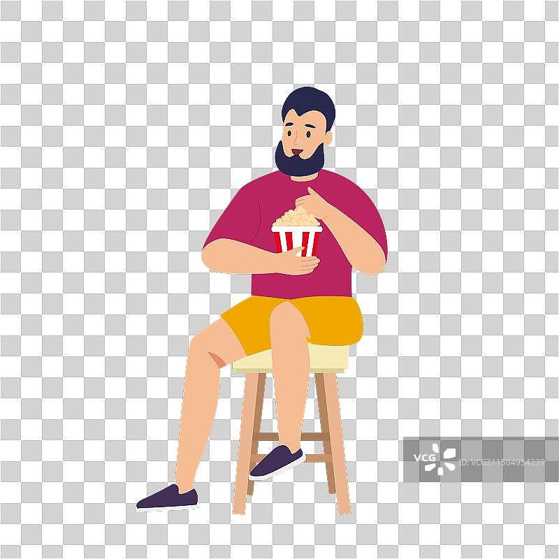 男人坐在椅子上吃爆米花图片素材