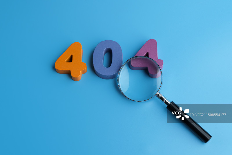 蓝色背景中的404错误和放大镜创意图图片素材