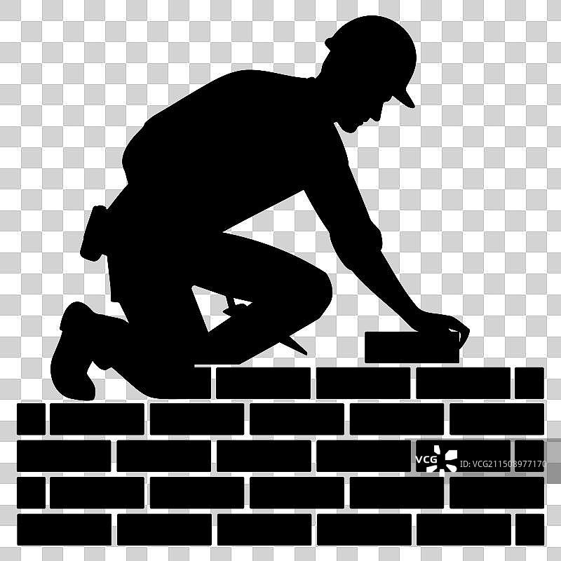 砌砖工人建造砖墙轮廓剪影图片素材