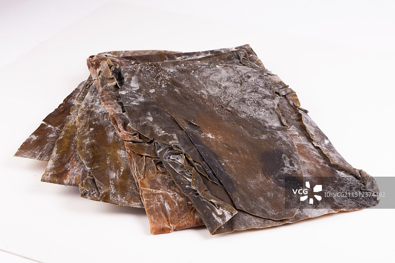 影棚拍摄白色背景干海鲜海带昆布特写图片素材