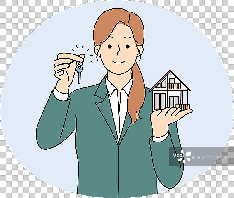 微笑的房地产经纪人拿着房屋模型和钥匙图片素材