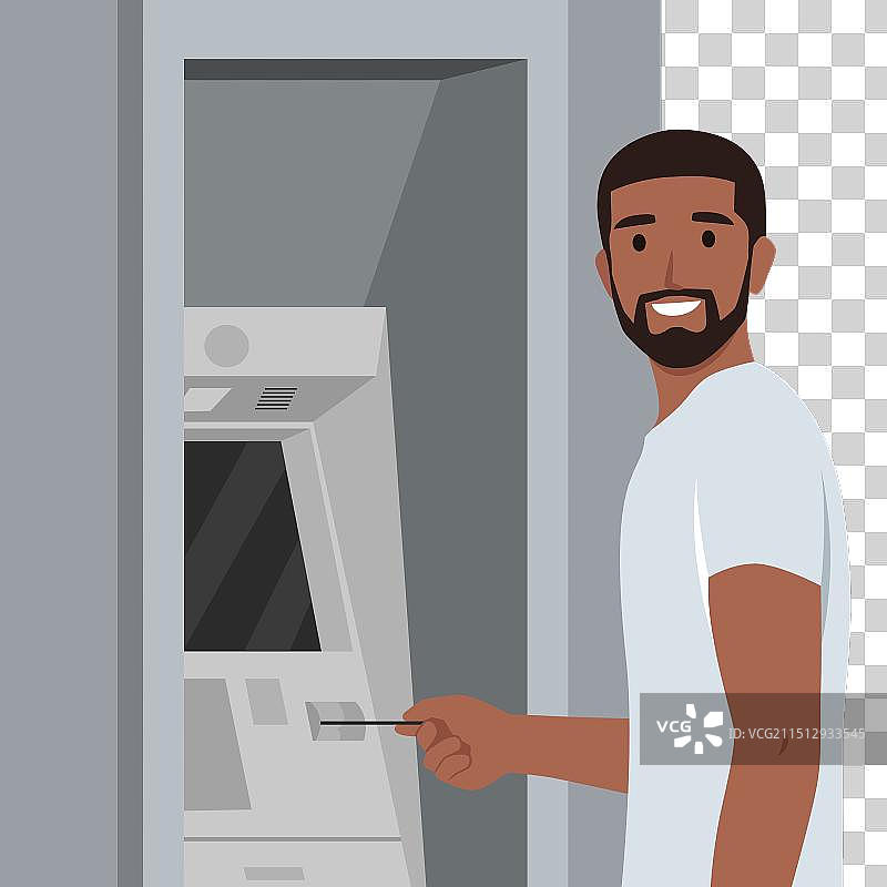 年轻男人站在ATM机前取款图片素材