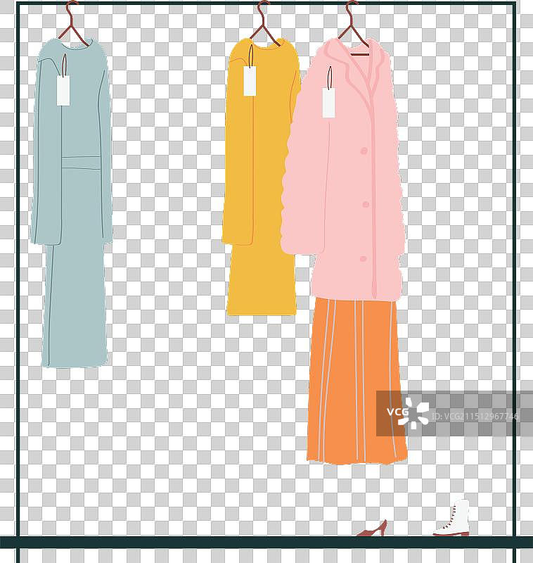 服装架上的粉色连衣裙、外套和鞋子图片素材