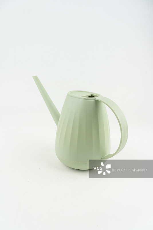 绿色塑料浇水壶图片素材