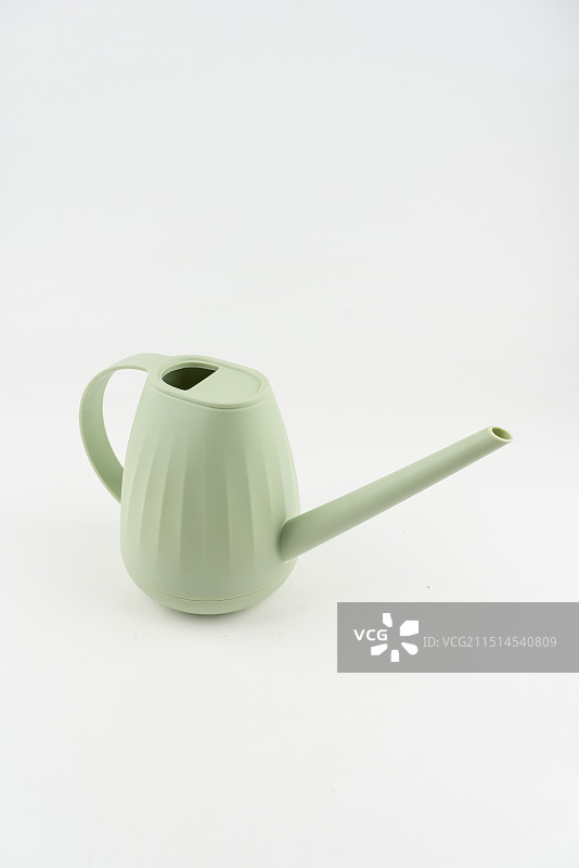 绿色塑料浇水壶图片素材