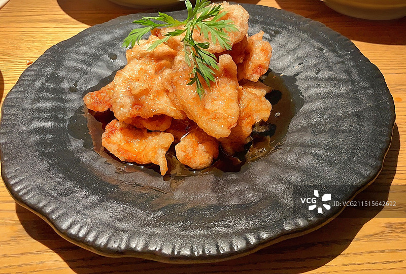 东北锅包肉大黑盘特写图片素材